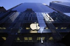 The Apple logo is lit on the first day of sale for the iPhone 6 and iPhone 6 Plus, in Sydney