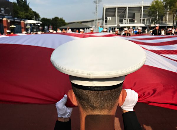 NEW YORK, NY - SEPTEMBER 10: Active Marines 6th Communication Battalion from Brooklyn, NY march back outside Arthur Ashe Stadium after the opening ceremony to the Women's Championship Final to fold the American Flag. Day Thirteen of the 2016 US Open at the USTA Billie Jean King National Tennis Center on September 10, 2016 in Queens. (Landon Nordeman for ESPN)