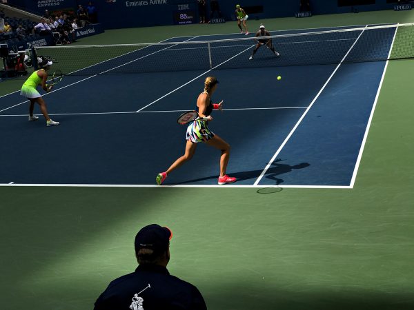 NEW YORK, NY - SEPTEMBER 11: Caroline Garcia (FRA) and Kristina Mladenovic (FRA) serve to Bethanie Mattek-Sands (USA) [12] and Lucie Safarova (CZE) [12] during the women's doubles finals in Arthur Ashe as the roof casts a shadow across the court on Day 14 of the 2016 US Open at the USTA Billie Jean King National Tennis Center on September 11, 2016 in Queens. (Landon Nordeman for ESPN)