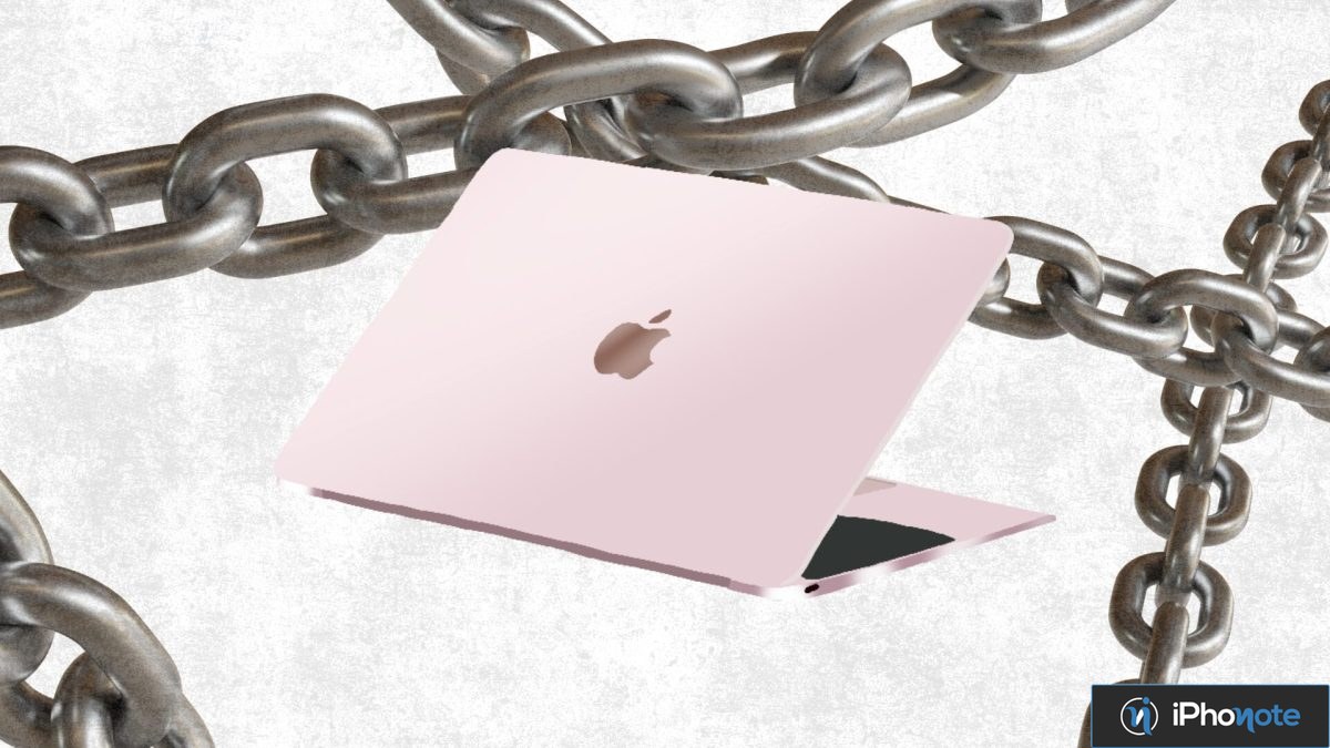 Ordinateur Mac entravé par de lourdes chaînes métalliques