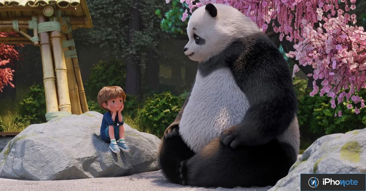 Petit garçon assis face à un panda géant dans un jardin zen