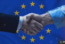 Apple revoit les commissions de l’App Store en Europe Poignée de main symbolisant l’accord entre Apple et l’Union européenne