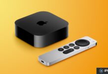 Boîtier Apple TV noir accompagné de sa télécommande argentée