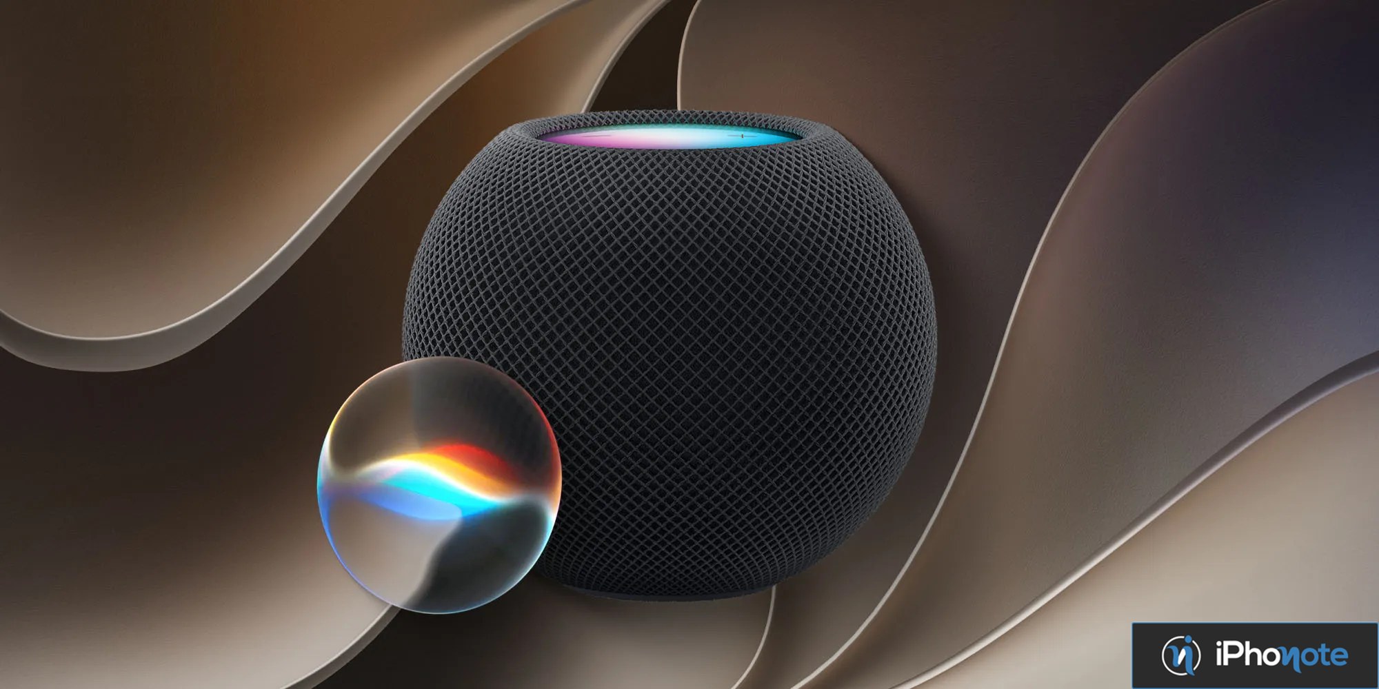 Rendu conceptuel d’un HomePod noir accompagné d’une sphère colorée