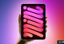 iPad mini : un modèle OLED attendu d’ici fin octobre Une tablette compacte tenue en main affiche un fond d’écran coloré.