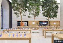 Apple Stores : la maison connectée bientôt mieux exposée Intérieur d’un Apple Store avec présentoirs muraux et produits exposés